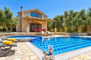 A stone villa with a swimming pool, outdoor seating, and a pergola. - Villa Tireda Tria - Three Bedroom Villa, Sleeps 6 (Koridallos)