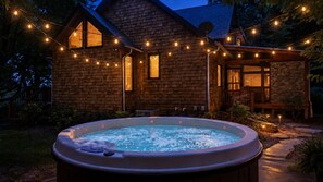 A wooden cabin with a hot tub and string lights. - Highlands Mountain Meadow -Luxury 4/3.5 cabin-Mins to Highlands-Views- Hot Tub (Scaly Mountain)