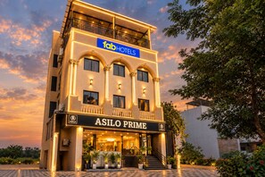 A multi-story hotel with a prominent 'fabHOTELS' sign and 'ASILO PRIME' branding. - FabHotel Asilo Prime (Indore)