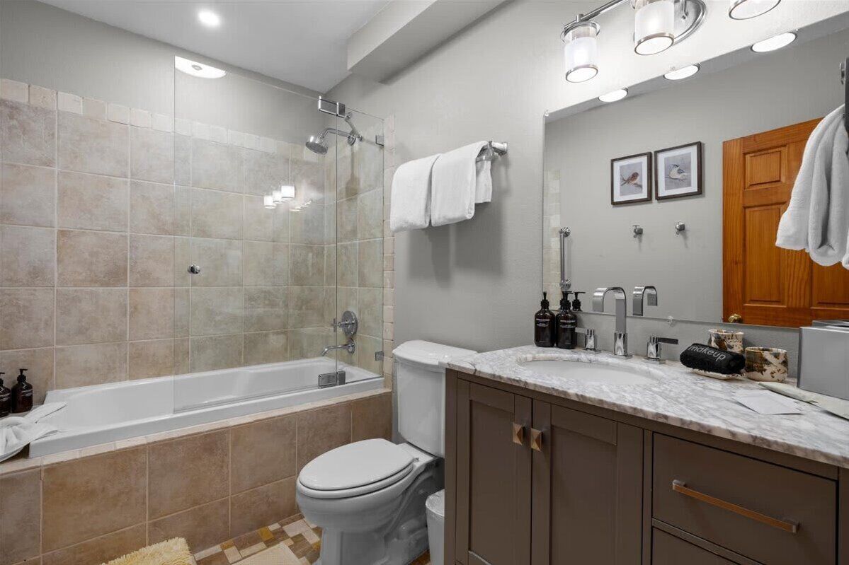 Cornet Creek Bathroom - Shower/tub combo with single vanity and grown alchemist products