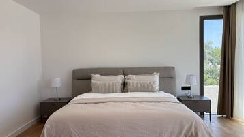 Desk, iron/ironing board, bed sheets