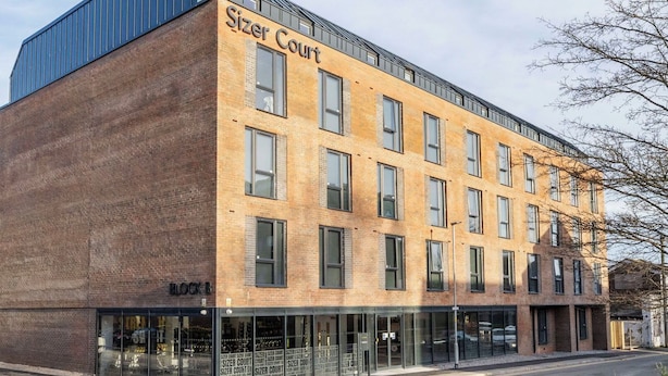 A modern building with the name 'Sizer Court' on the facade. - Student Only Sizer Court (Preston)