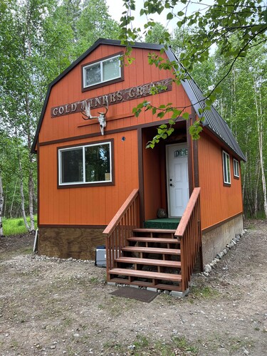 Retreat to this quiet 1 bedroom cabin in the woods near a lake.
