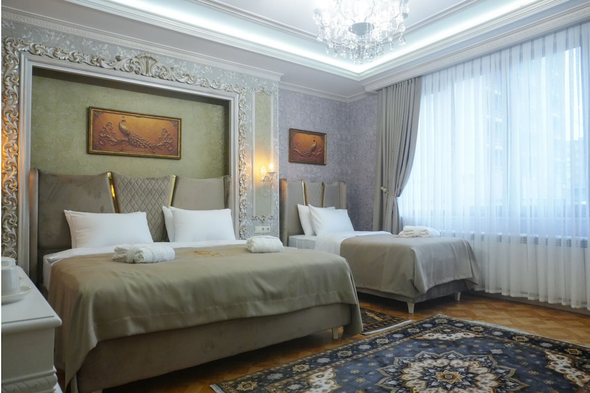 Deluxe Triple Room, Balcony, City View | In-room safe, soundproofing, free WiFi