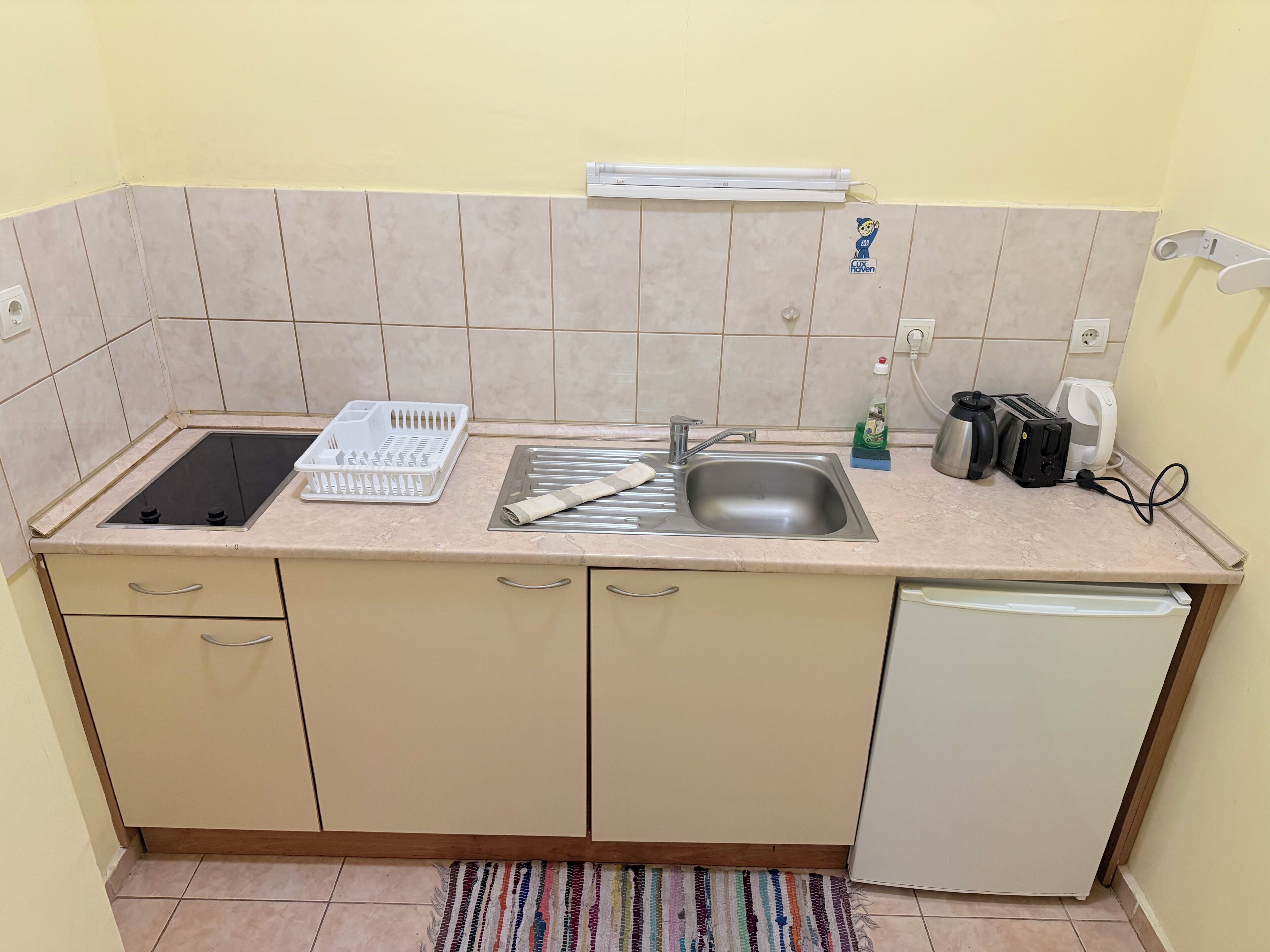 Family Studio Suite, Balcony, Mountain View | Private kitchen | Fridge, microwave, stovetop, highchair