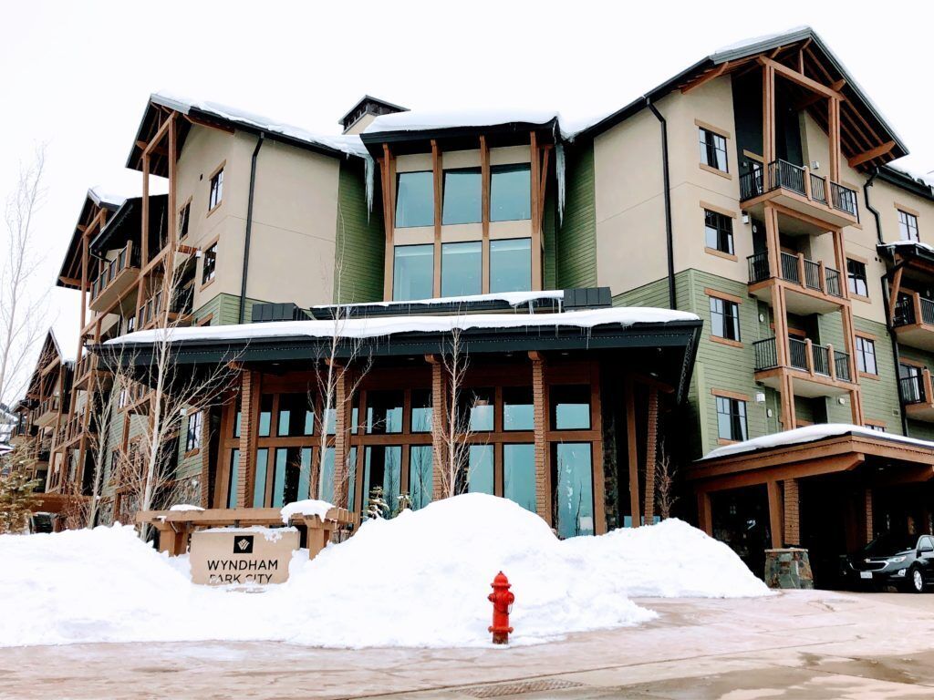 A multi-story building with a sign indicating 'Wyndham Park City.'