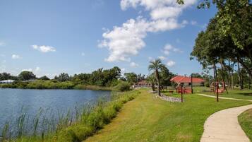 A park with a lake, walking paths, and a playground.