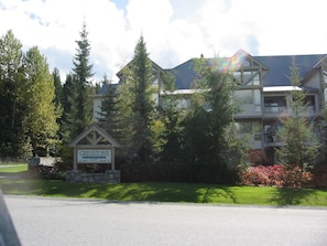 A multi-story building with a sign labeled 'GREYSTONE'. - Ski in Ski out condo in Whistler. Just a 3 minute walk from the upper village. (Whistler)