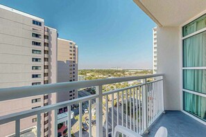 A balcony with a view of surrounding buildings and a clear sky. - Carolinian Beach Resort 1135 (Myrtle Beach)