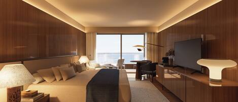 A modern hotel room with a large bed, a TV, and a balcony with a view.
