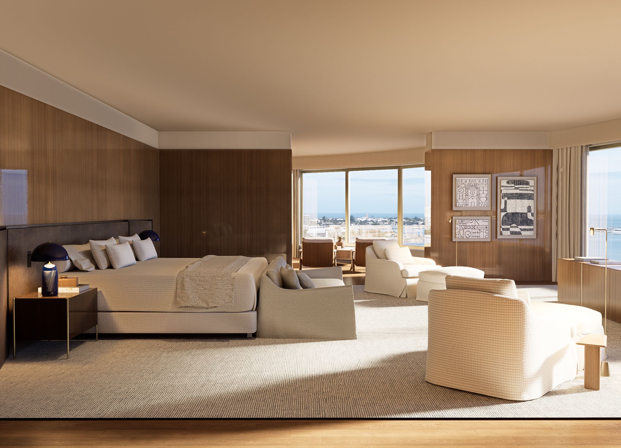 Una habitación de hotel moderna con una cama grande, un sofá, una silla y vistas a la ciudad.