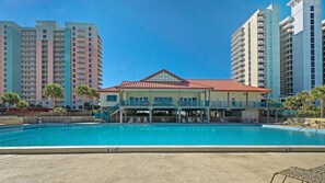 A hotel with a pool, a covered deck, and a view of surrounding high-rise buildings. - Santa Rosa Dunes 321 (Pensacola Beach)
