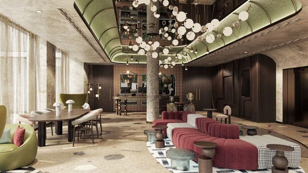 A spacious lobby with a high ceiling, a central column, and a seating area with sofas and chairs. - Canopy By Hilton Warsaw (Warsaw)