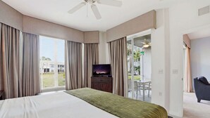 A hotel room with a large bed, a television, and a view of the outdoors. - 414 -Wheelchair Accessible - Sleeps 6 (Naples)