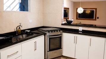 Premium House | Private kitchen | Fridge, microwave, oven, cookware/dishes/utensils