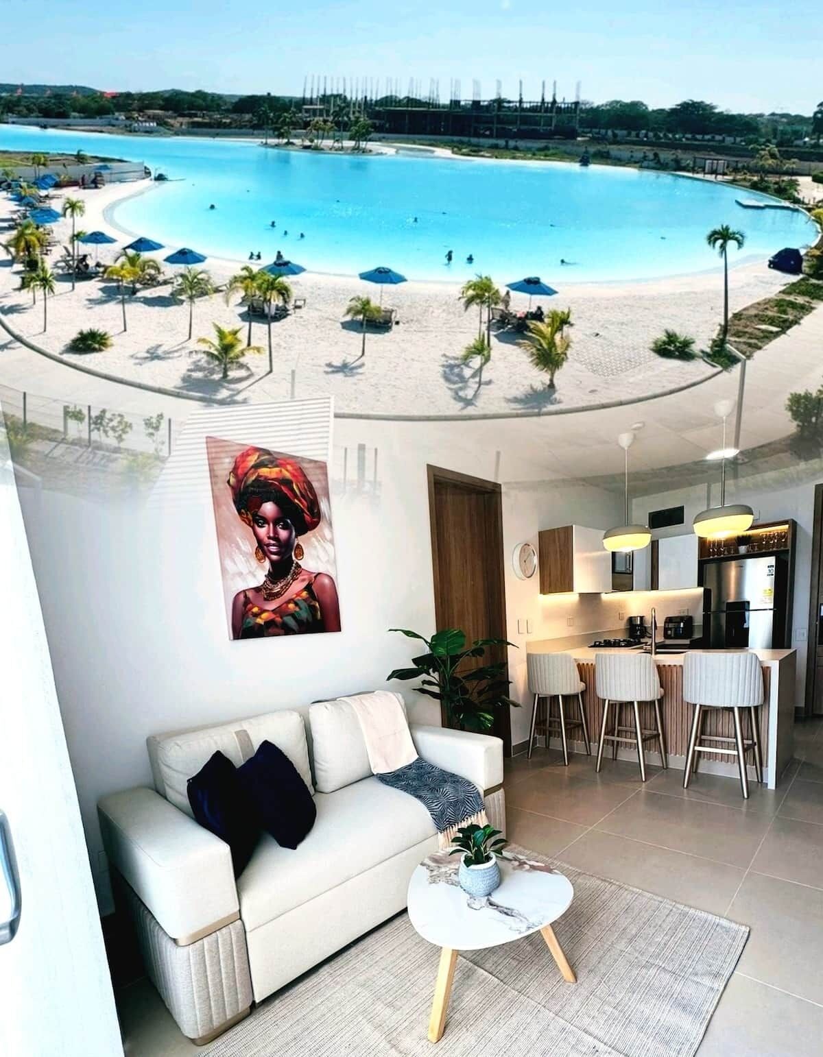 A modern living room with a view of a beach and pool.