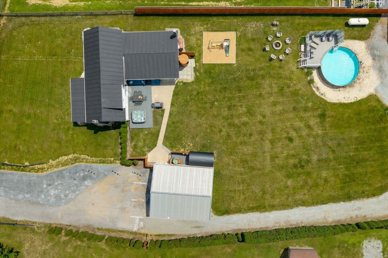 Aerial perspective of the property showcasing the home`s layout and generous outdoor space.