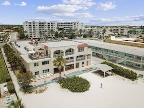 A hotel with multiple floors, a pool, and a beach area. - Rooftop Oceanview Condo on the Beach Sand w/ Pool! (North Redington Beach)