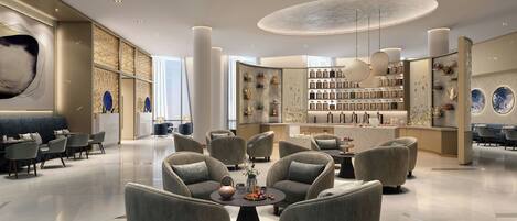A modern lounge area with sofas, a coffee table, and a bar with shelves of bottles.
