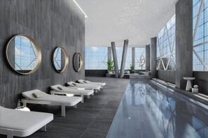 A modern spa with a long bench seating area, large windows, and a reflective pool. - Delta Hotels By Marriott Jeddah Al Salam (Jeddah)