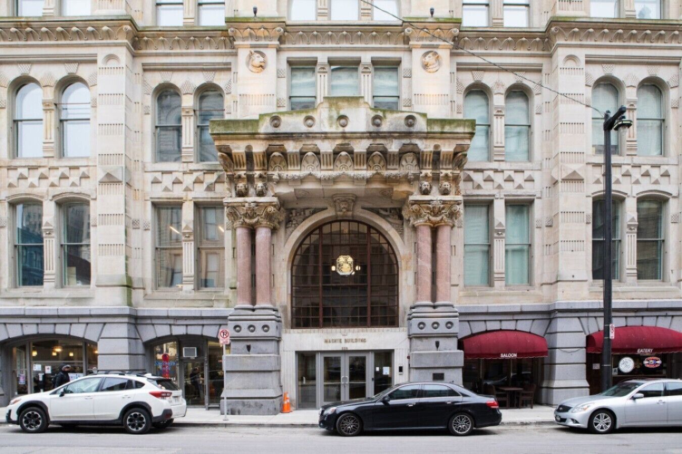 A historic building with ornate architectural details, including a grand entrance and multiple windows.