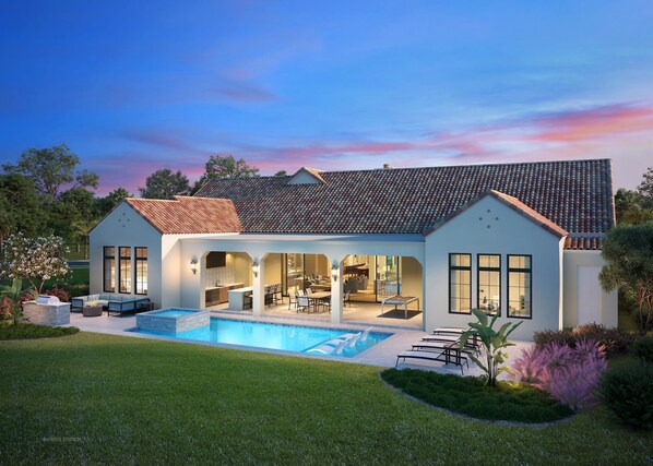 Una casa moderna con piscina, mobiliario de exterior y un jardín bien cuidado.