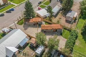 A residential area with multiple houses, a road, and parked cars. - New Home! Teton Bungalow A - 1 Bedroom & LOFT! (Driggs)