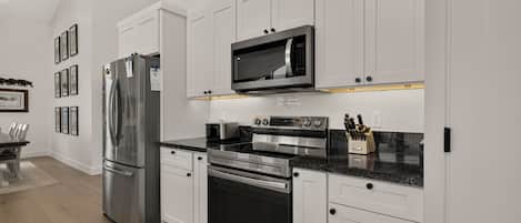 Coffee/tea maker, fridge, microwave, oven