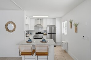 Coffee/tea maker, fridge, microwave, oven