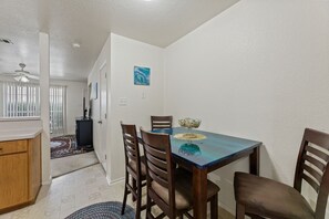 A dining area with a table, chairs, and a decorative centerpiece. - 5BR/3.5BA – Two Adjacent Townhomes. Ideal for Groups.  Sleeps 14 (Killeen)