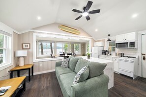 A modern kitchen with white cabinets, a built-in oven, and a microwave. - Cabin 41 at The Historic Sandy Point Resort w/ Boat Slip and Onsite Boat ramp (Alton)