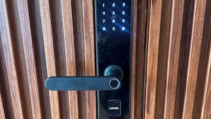 A modern door lock with a keypad and a keyhole.