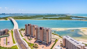 A high-rise hotel with a view of a coastal road and water. - Coastal Condo with Pool, Spa & Beach Fun Awaits - Condo Islands End 602 - Roelens (Fort Myers Beach)