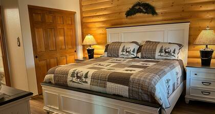 Quiet & Cozy Cabin Retreat with Covered Deck + Stone Fireplace