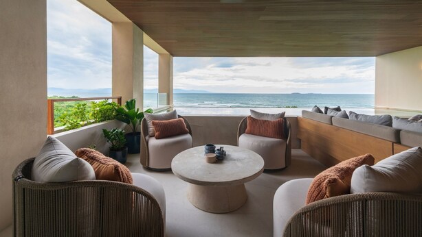 A spacious outdoor seating area with a view of the ocean and distant mountains. - Condo Surf 4BD - Surf Punta Mita (Punta de Mita)