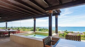 A covered outdoor area with a hot tub, seating, and a view of the ocean. - Ph Bugambilia 4BD - Tau Punta Mita (Punta de Mita)