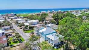 A residential area with houses, a road, and a view of the ocean. - Sandbar Drift - Where the Coast Slows Down. (Laguna Beach)
