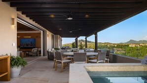 A covered outdoor patio with a pool, dining area, and a view of the landscape. - PH Prima Vista 4BD - Tau Punta Mita (Punta de Mita)