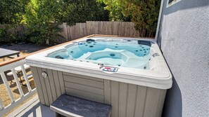 A hot tub with a control panel, a wooden deck, and a wooden fence in the background. - Lake Park Landing by Avantstay Spa + Firepit + BBQ Near Atascadero Lake Park (Atascadero)
