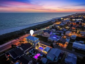 A coastal residential area with houses, a beach, and a road. - Casa Elcoqui | LUX Gulf Views, Pool + Spa, Sleeps 16 (Panama City Beach)