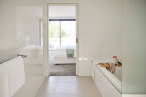 A modern bathroom with a shower, toilet, and a glass-enclosed shower area. - Swanston Sands Sophisticated Comfort by the Beach (Geelong)