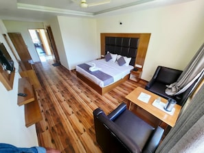 Habitación Deluxe | Camas extra y ropa de cama