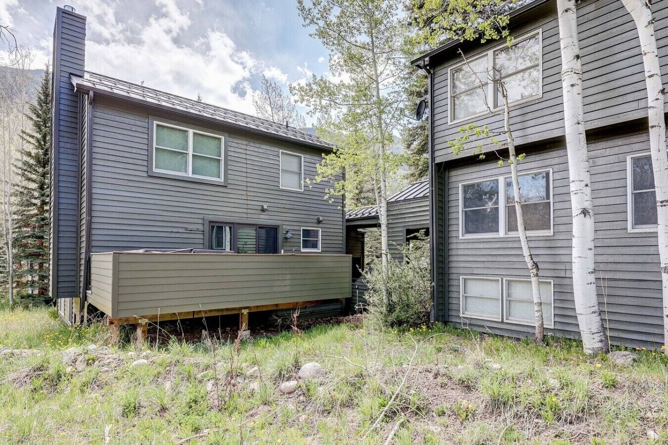 A two-story building with a covered deck area in front.