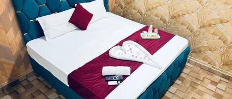 Chambre Deluxe | Lits pliants/supplémentaires, draps fournis