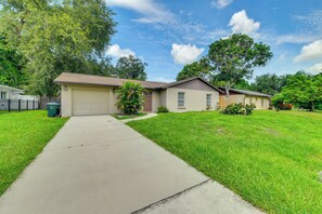 A residential property with a garage, a front lawn, and a pathway leading to the entrance. - 6 Mi to Dtwn! Centrally Located Sarasota Home (Sarasota)