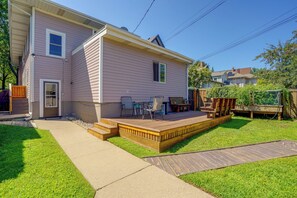 A residential house with a covered patio, a lawn, and a wooden deck. - Near Hospitals & Colleges! Stylish St Paul Apt (St Paul)