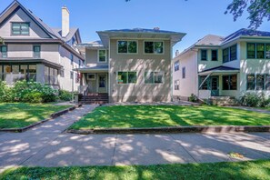 A residential area with multiple two-story houses, a well-maintained lawn, and a clear sky. - Near Hospitals & Colleges! Stylish St Paul Apt (St Paul)