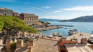 A coastal town with historic buildings, a marina, and a view of the sea and mountains. - [FinestraNelBorgo] 5Terre-Portovenere-Seaview (Porto Venere)