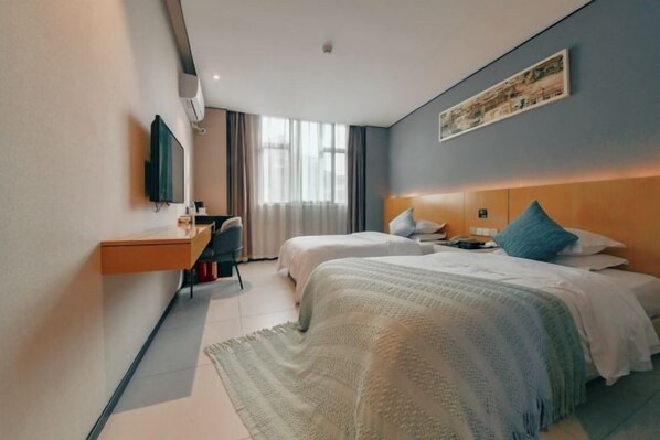 A hotel room with two beds, a desk, a television, and a window with curtains. - Shangyuan Hotel Chain (Guangzhou Thirteen Factories Yide Road Metro Station) (Guangzhou)