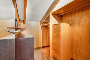A room with a wooden cabinet, a wooden dresser, and a wooden ceiling with exposed beams. - [GoodTimes] Near the station-5Terre-A/C (La Spezia)